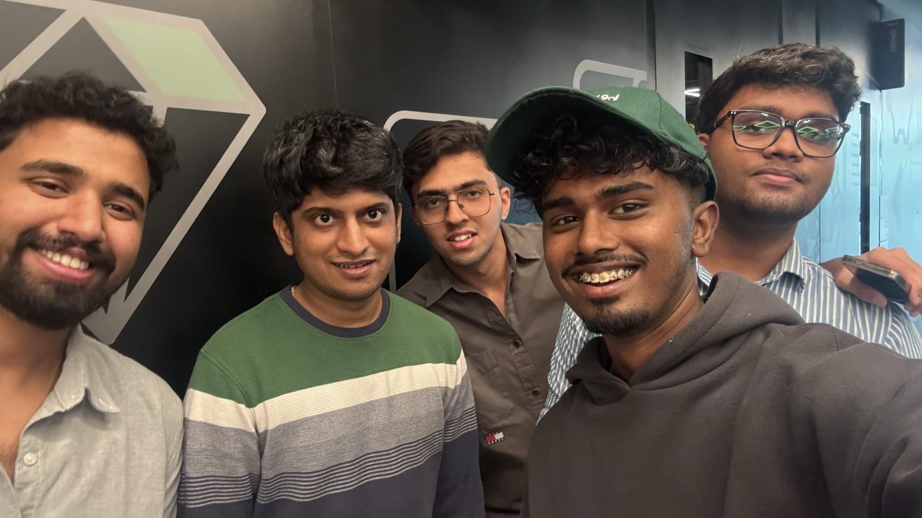 five friends taking a photo together